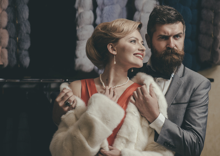 Couple in love among fur coat, luxury. couple in love at romantic date, valentines day.の写真素材