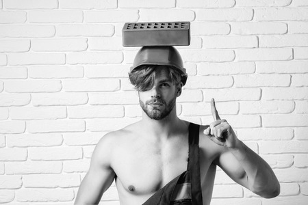 young handsome bearded macho man builder with sexy muscular athletic strong bodyの写真素材