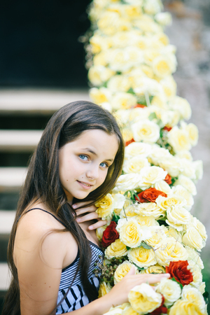 Girl pose with yellow rosesの写真素材
