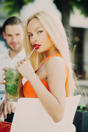 Sensual woman date handsome man. Sexy couple in love in cafe outdoor. Love, proposal, romance concept. Lovers, relations, relationship. Celebration, party, birthday.の写真素材