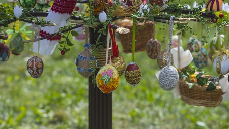 Handmade eggs with traditional easter design. Easter eggs collection hang on spring tree. Happy easter day. Easter decoration concept. Spring holidays celebration.の写真素材
