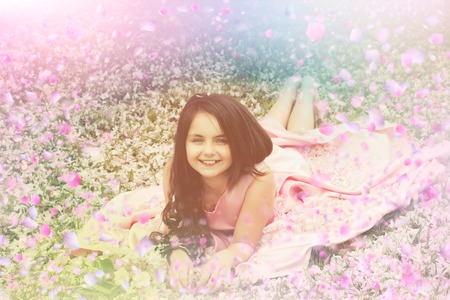 Happy children in suny day. Child have fun with flowersの写真素材