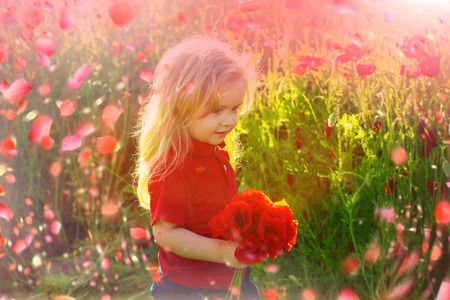 Child in spring flowers. spring flowers background.の写真素材