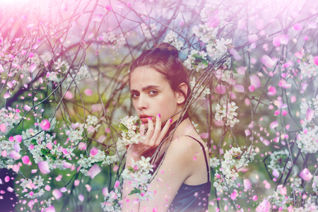 Caucasian girl in flowers. Spring flowersの写真素材