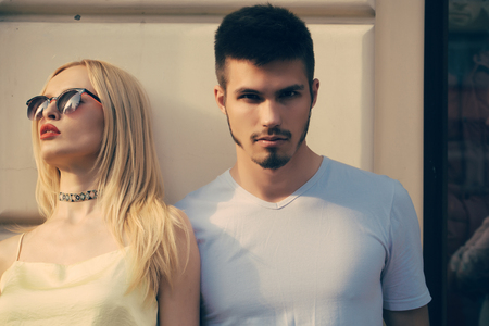 Sexy couple on street on sunny summer day. Sensual woman date handsome man. Couple in love outdoor. Love, romance concept. Lovers, relations, relationship.の写真素材