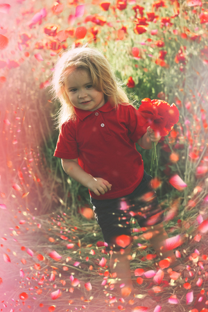 Child in spring flowers. spring flowers background.の写真素材
