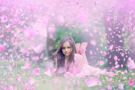 Child in spring flowers. spring flowers background.の写真素材