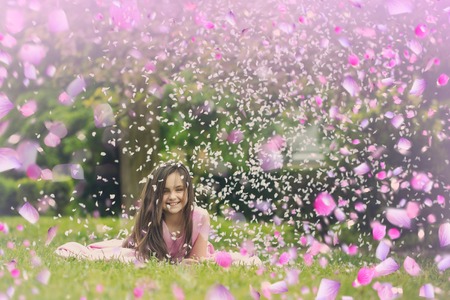 Happy children in suny day. Child have fun with flowersの写真素材