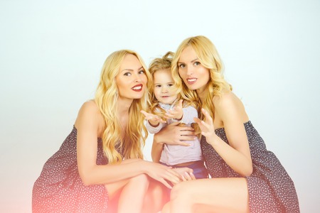 Mothers day, family values, trust, childhood. mother and son, happiness, nephew. Love, happiness, parenting. Happy family play with toy balls. Child small boy and twins women, relatives.の写真素材