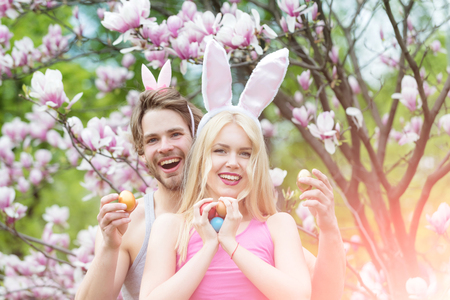 happy easter of man and woman with eggs. Sensual woman and man with easter eggs.の写真素材