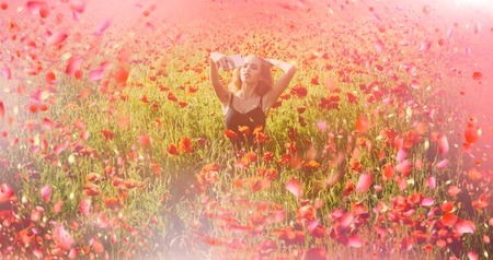 Girl in poppy meadow. Blooming poppy.の写真素材