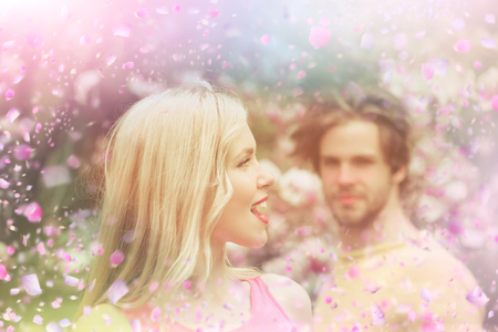 Booming flowers. Couple in blooming park.の写真素材