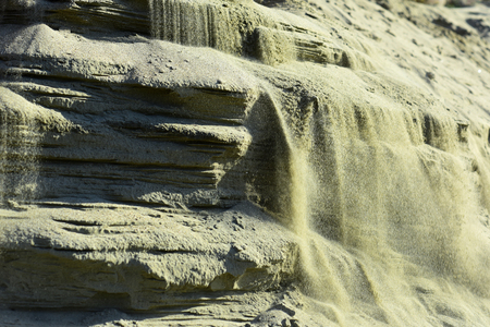 Bright grey background with layers of sand and clay