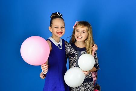 Fashion and beauty, little princess. Family fashion model sisters, beauty. Little girls in fashionable dress, prom. Friendship, look, hairdresser, wedding. Children girls in dress, family and sisters.の写真素材