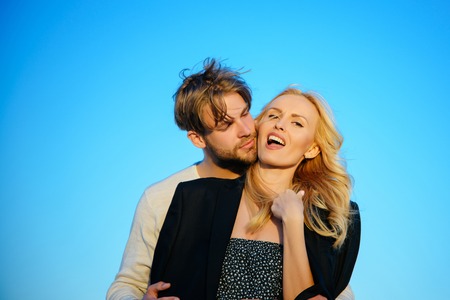 Muscular man and woman with long blond hair, love. Family couple of man and sexy girl, trust....