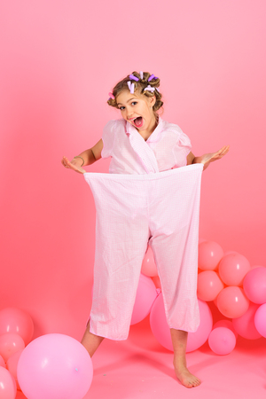 Pajama party balloons on pink studio background. pajama party of girl with baloonsの写真素材
