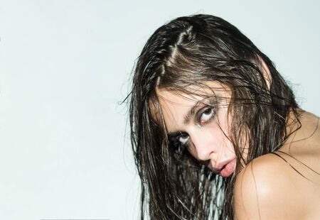Fashion look of stylish girl, makeup trend. Fashion model with wet hair and smoky eyes. copy spaceの写真素材