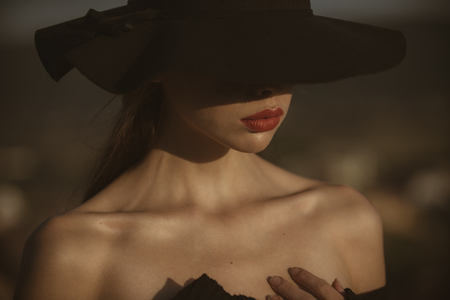 Beauty and fashion, cosmetics. beauty of pretty young woman in black hat.の写真素材