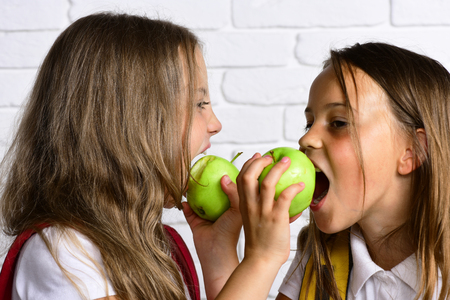 healthy food and dieting. little kids eat fresh apple.の写真素材