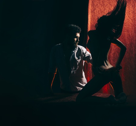 Passionate couple, boy and girl at bed in berroom