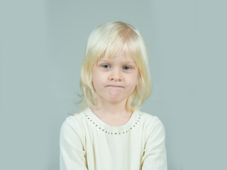 Little girl with young tender skin. Kid with blonde hair. Childhood and happiness of innocent girl....