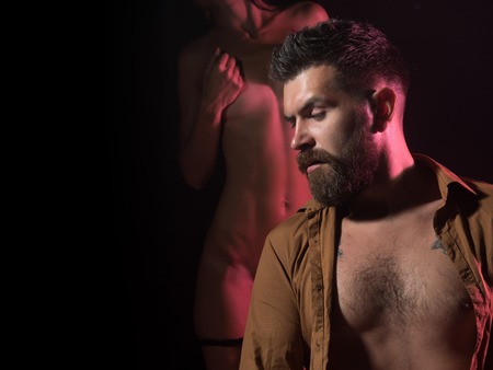 Erotica. attractive nude woman and bearded man, coupleの写真素材