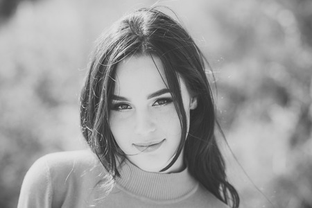 Girl with makeup face smiling on sunny dayの写真素材