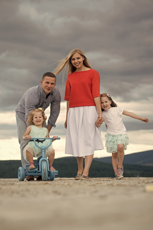 Children and parents travel in mountainの写真素材