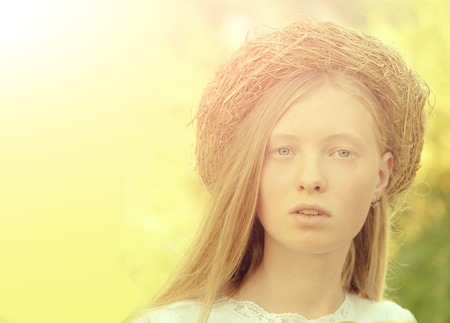 Sensual woman with no makeup look, natural beauty. Woman with wreath on long blond hair. Albino girl on blurred sunny outdoor. Natural beauty and no makeup look, copy space.の写真素材