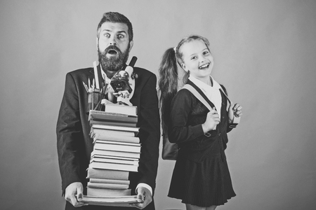 Home schooling and back to school concept. Father and schoolgirlの写真素材
