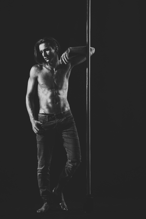 Tired dancer concept. Man with nude torsoの写真素材