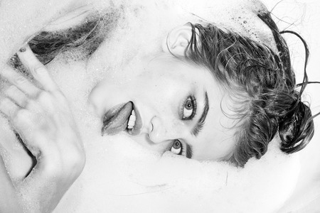 Playful woman in bath