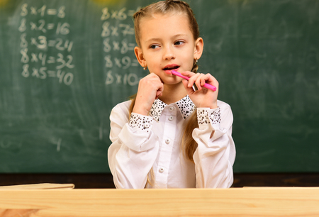 Final exam test in university students study for examination in classroom. Children must be taught how to think not what to think. Pupil is having one-on-one time with his instructor.の写真素材