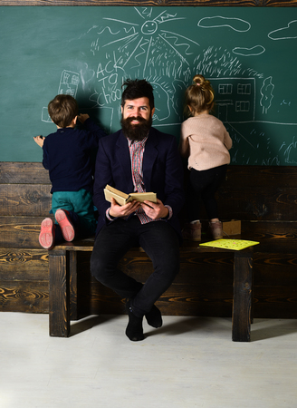 Tutor will have to re-evaluate the students objectives. Educational concept - schoolchildren in a classroom. Enrichment classes can be difficult for some kids so tutors are best.の写真素材