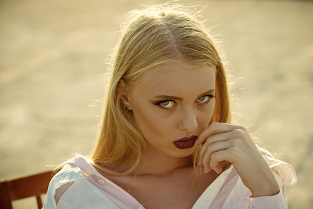 Girl with sensual lips, makeup face and long blond hairの写真素材