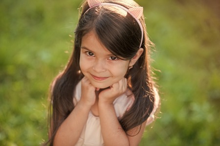 Child with long hair, hairstyle, smiling look