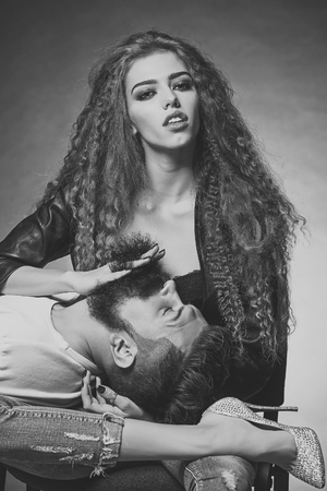 Woman running fingers through beardの写真素材