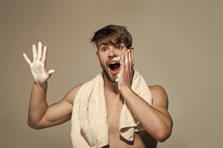 Man apply shaving cream or foam on bearded skinの写真素材