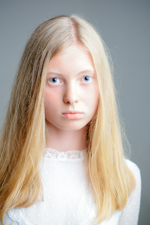 Natural beauty and skincare. Woman with natural beauty look and no makeup. Sensual woman with blond long hair. Albino girl with blue eyes and white skin.の写真素材