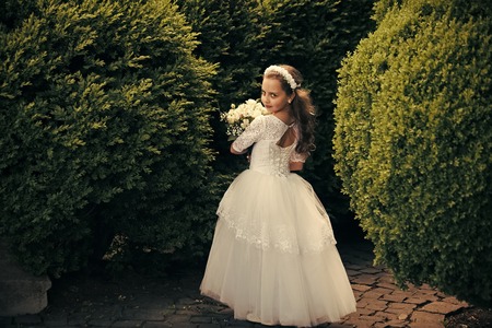 Beautiful little child girl wearing dressの写真素材