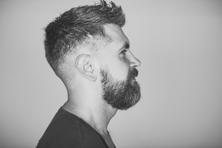 Serious man. Hipster with bearded face profile and stylish hairの写真素材