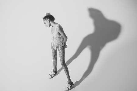 Sensual woman body. Sexy girl in sportswear with shade or silhouette.の写真素材