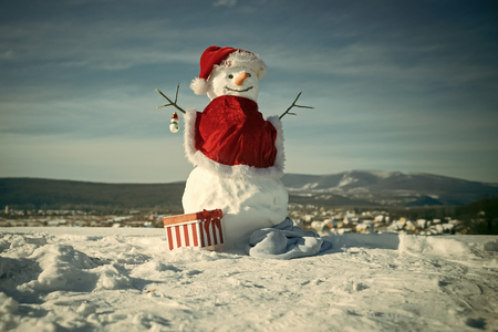 Happy New Year with Snowman. Snowmans happy couple. Snowmans celebration. Snowman in red santa claus hat.の写真素材