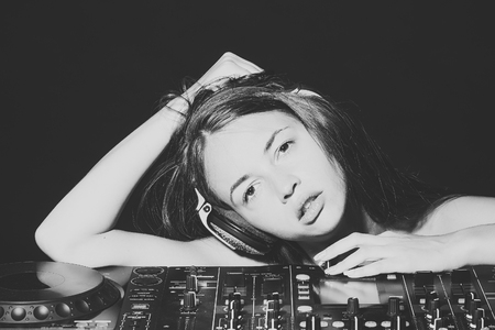 Sensual love game. Couple in love. Pretty disk jockey girlの写真素材