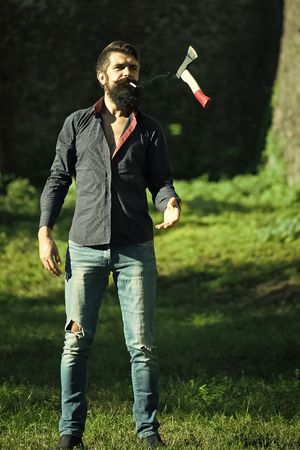Face boy for magazine cover. Man face portrait in your advertisnent. Bearded man with axeの写真素材