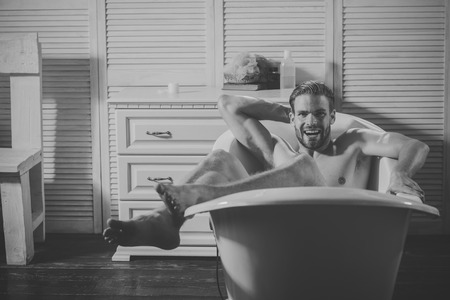 Mens heals care. Man relaxing in spa bathの写真素材