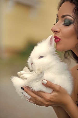 Sensual woman body. Smiling woman with rabbit