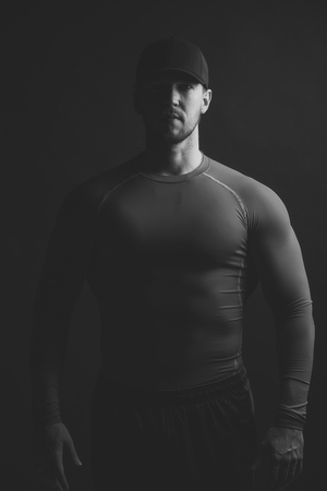 Serious man. Muscular man in redの写真素材