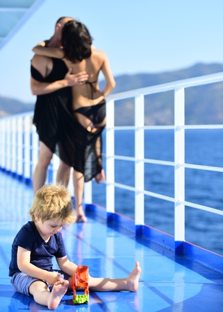 Summer vacation of happy family. Love and trust as family values. Mother and father with son in sea trip.Child play with toys at father and mother. Family travel with kid on mothers or fathers day.の写真素材