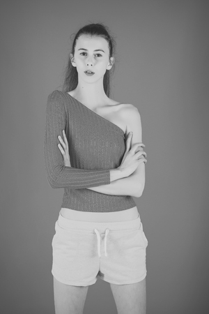 Girl Powered. Issues face girls. Fashion model pose in studio on blue background.の写真素材